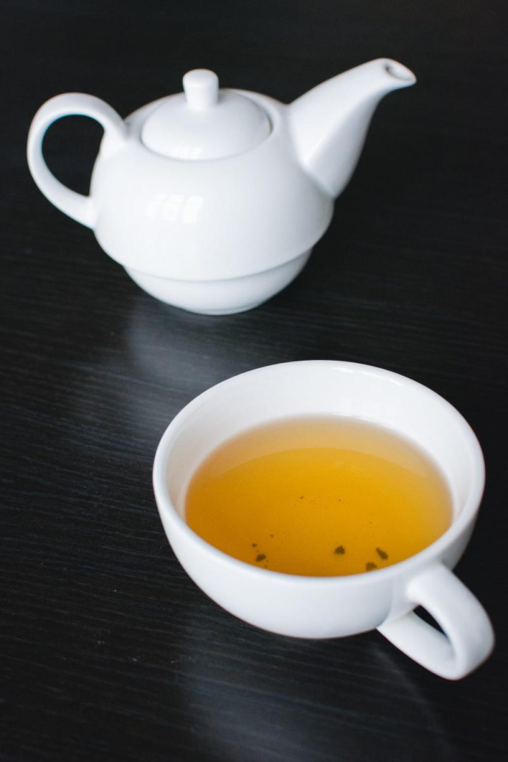 Afternoon black tea in a white teapot Afternoon black tea in a white teapot