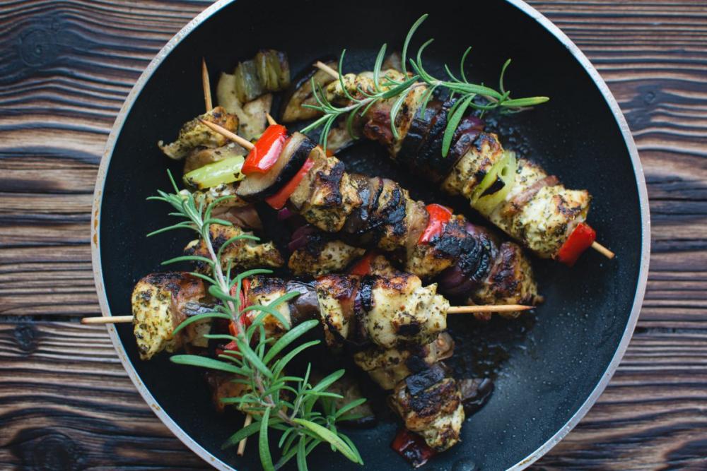 Chicken skewers on a wooden background Chicken skewers on a wooden background