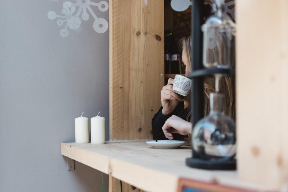 Girl drinking coffee at a window seat Girl drinking coffee at a window seat