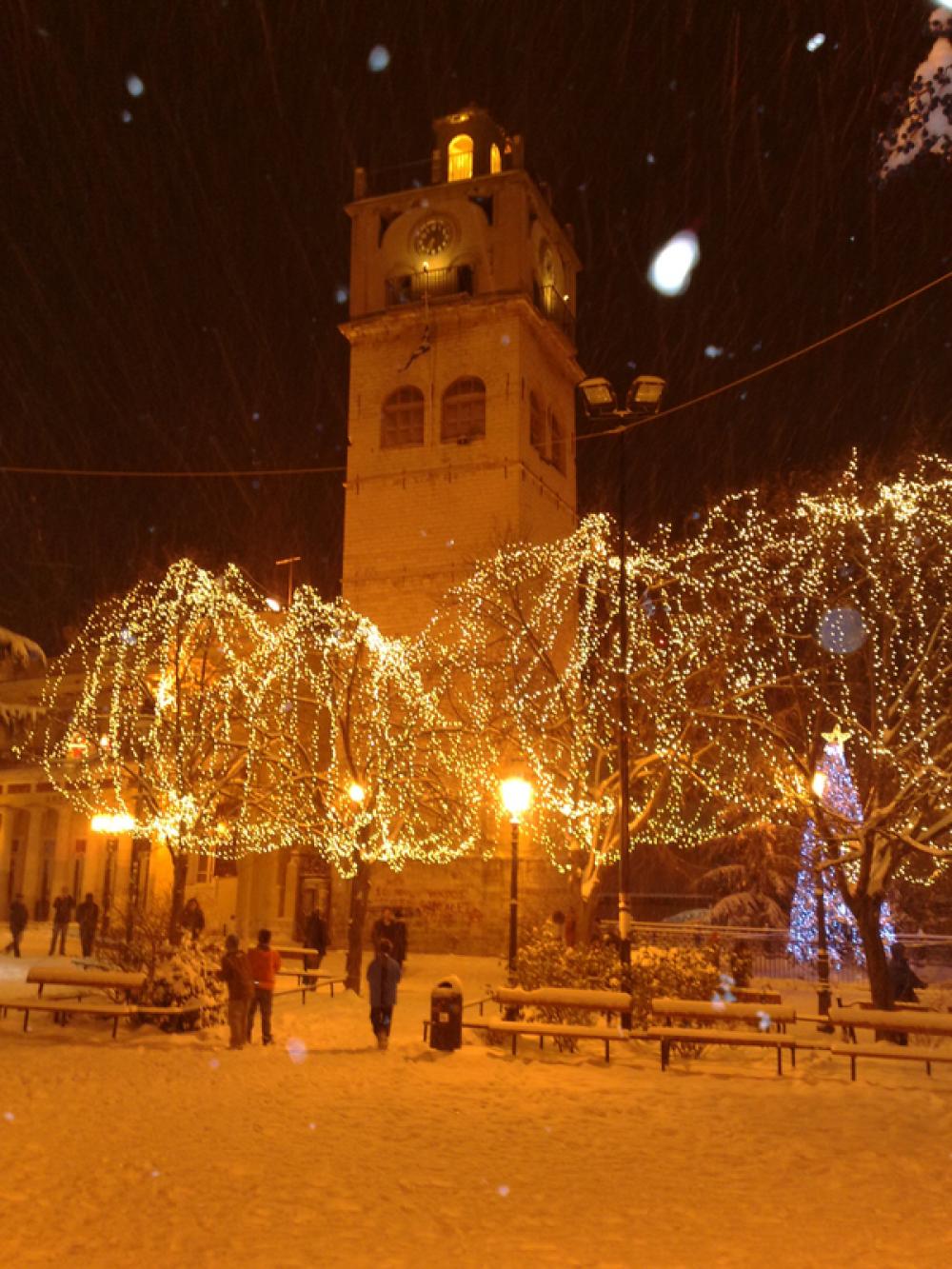 The clock tower during Christmas with Lights in Kozani, Greece free photo The clock tower during Christmas with Lights in Kozani, Greece free photo