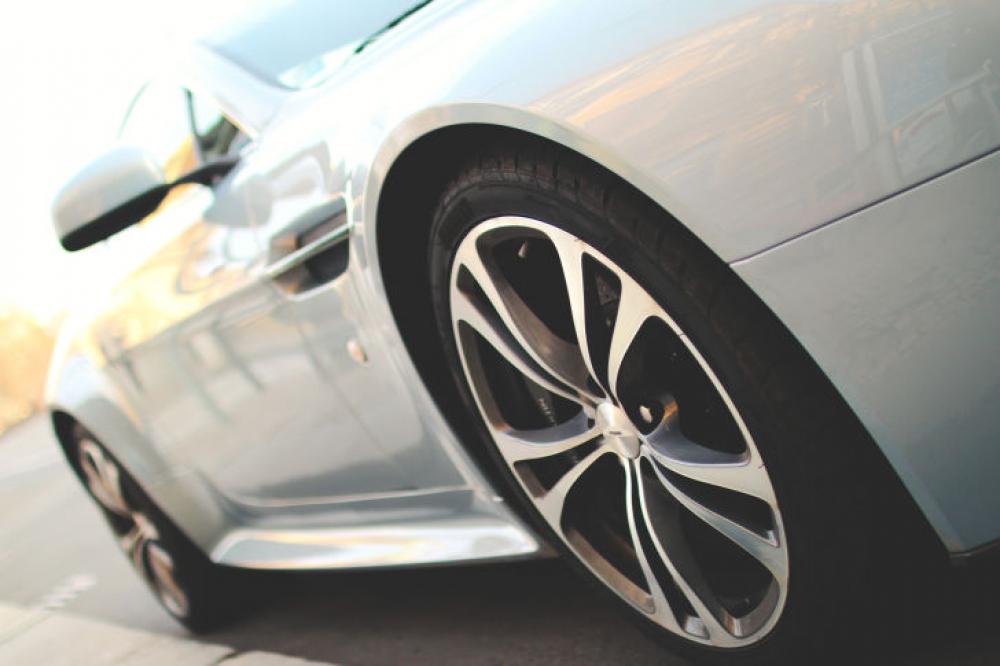 Super luxury silver car parked on the street Super luxury silver car parked on the street