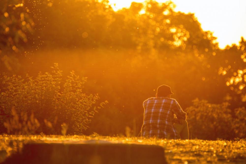Young man is looking at the sunset Young man is looking at the sunset