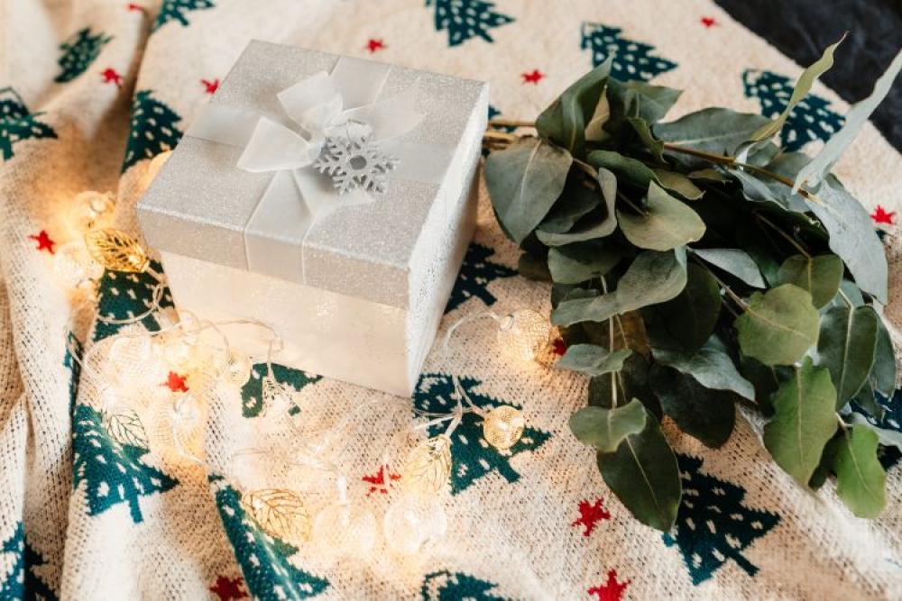White decorative gift box on a blanket White decorative gift box on a blanket