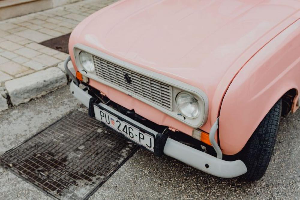 Pink Renault 4 on the street in the city of Rovinj, Croatia Pink Renault 4 on the street in the city of Rovinj, Croatia