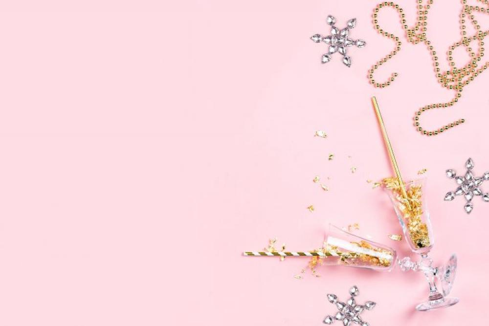 New Years Eve party decorations on pink background New Years Eve party decorations on pink background