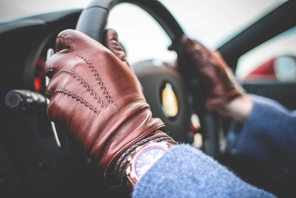 Driver with Brown Leather Driving Gloves Driver with Brown Leather Driving Gloves
