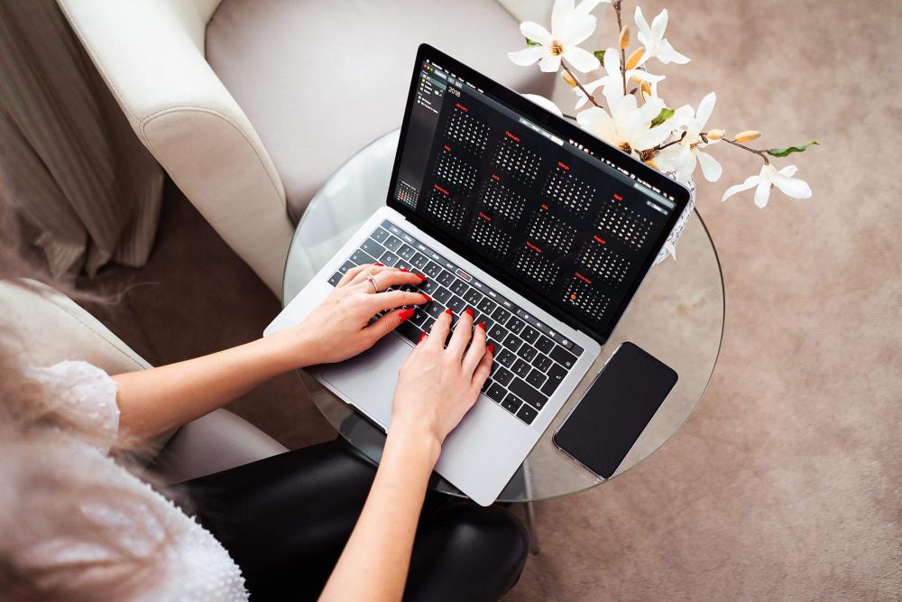 Woman Entrepreneur Working on Her Modern Laptop Woman Entrepreneur Working on Her Modern Laptop