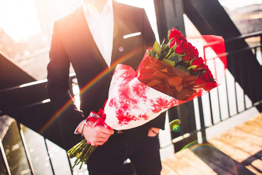 Gentleman Holding a Bouquet of Roses and Waiting for His Wife Gentleman Holding a Bouquet of Roses and Waiting for His Wife