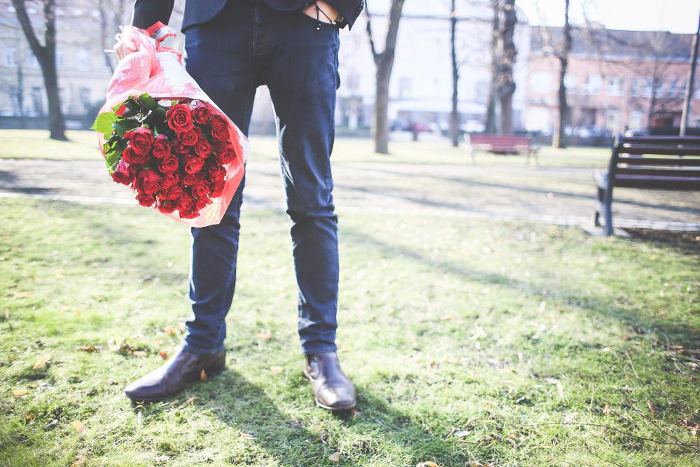 Gentleman Holding a Bouquet of Roses Gentleman Holding a Bouquet of Roses