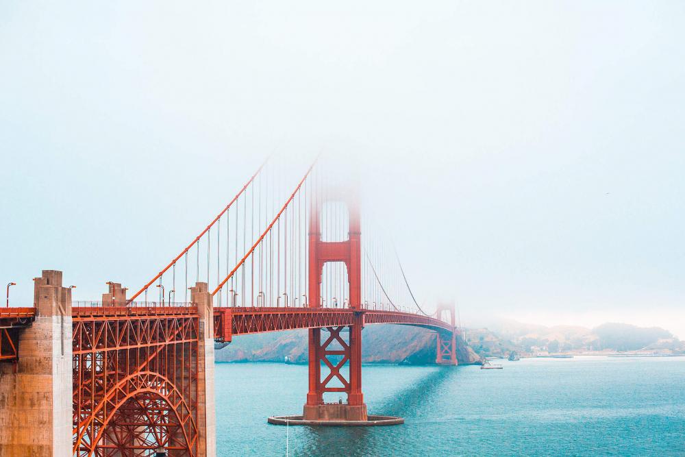 The Golden Gate Bridge Partly Covered in Fog The Golden Gate Bridge Partly Covered in Fog
