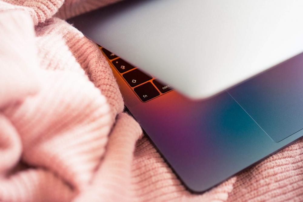 MacBook in Pink Sweater MacBook in Pink Sweater