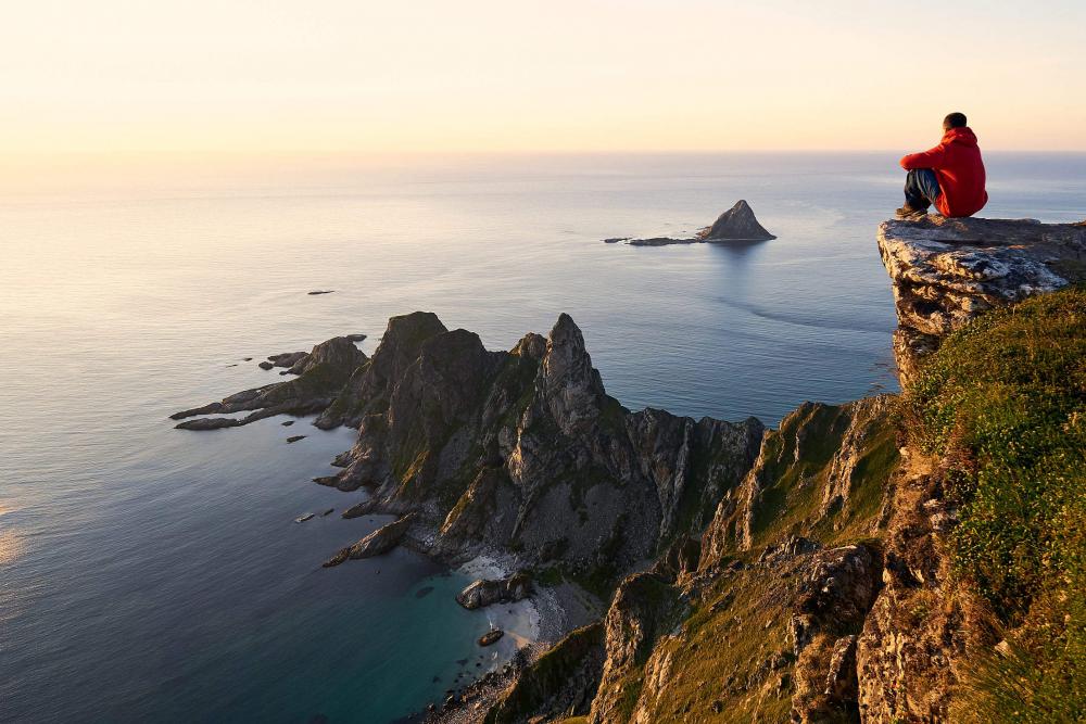 Man Enjoying the View from the Edge of the Cliff Man Enjoying the View from the Edge of the Cliff