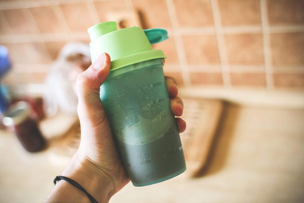 Man Holding Fitness Gainer/Protein Shake Man Holding Fitness Gainer/Protein Shake