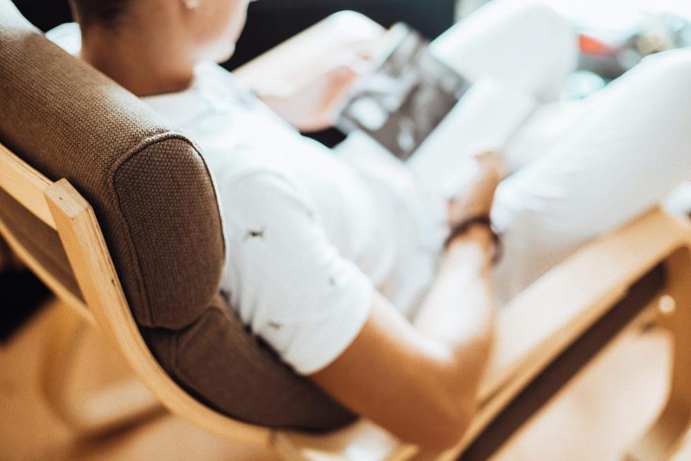 Man Reading a Book in a Chair Man Reading a Book in a Chair