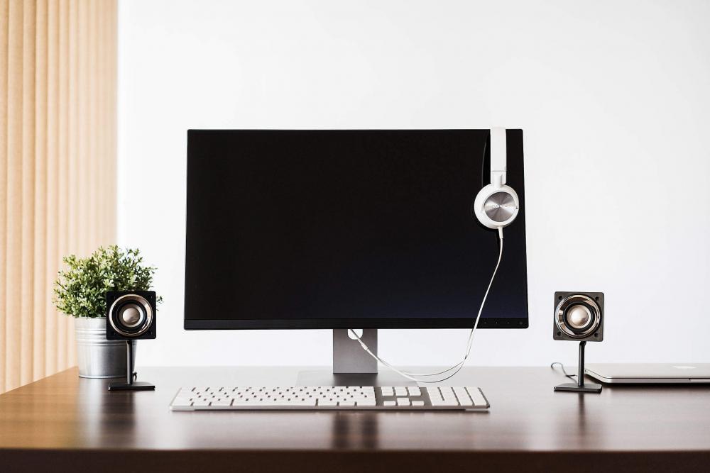 Modern Desktop Setup and White Headphones Modern Desktop Setup and White Headphones