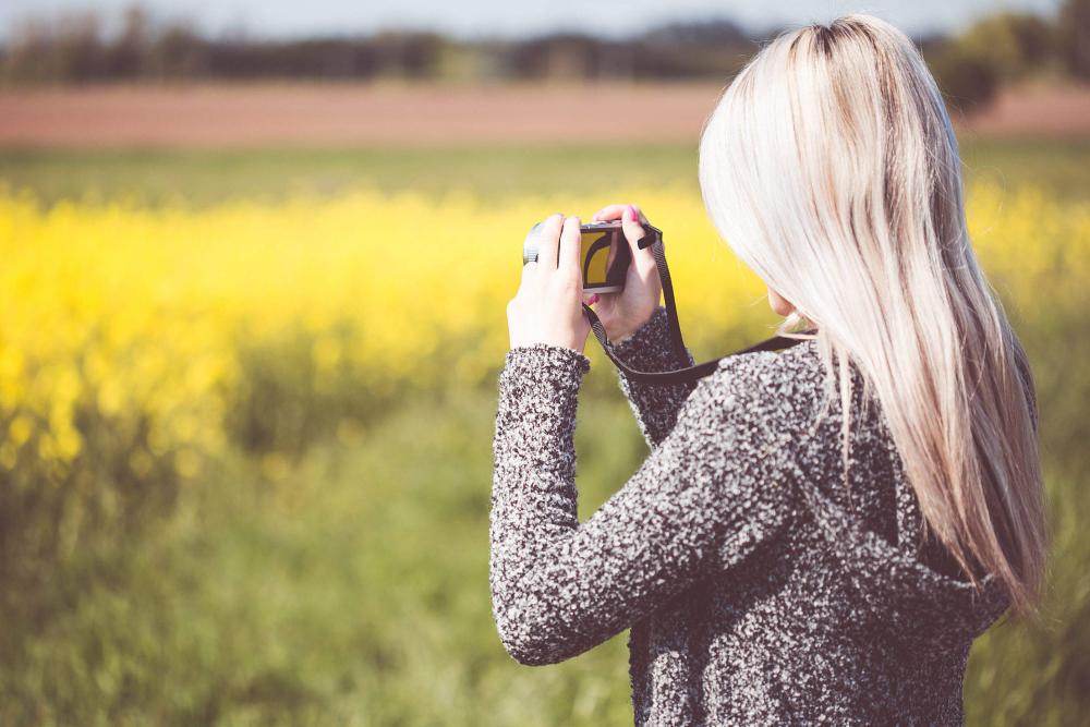 Girl Taking a Photo in Nature Girl Taking a Photo in Nature