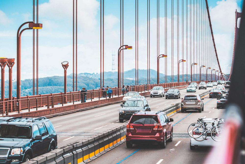 Traffic: a Lot of Cars Driving Across The Golden Gate Bridge Traffic: a Lot of Cars Driving Across The Golden Gate Bridge