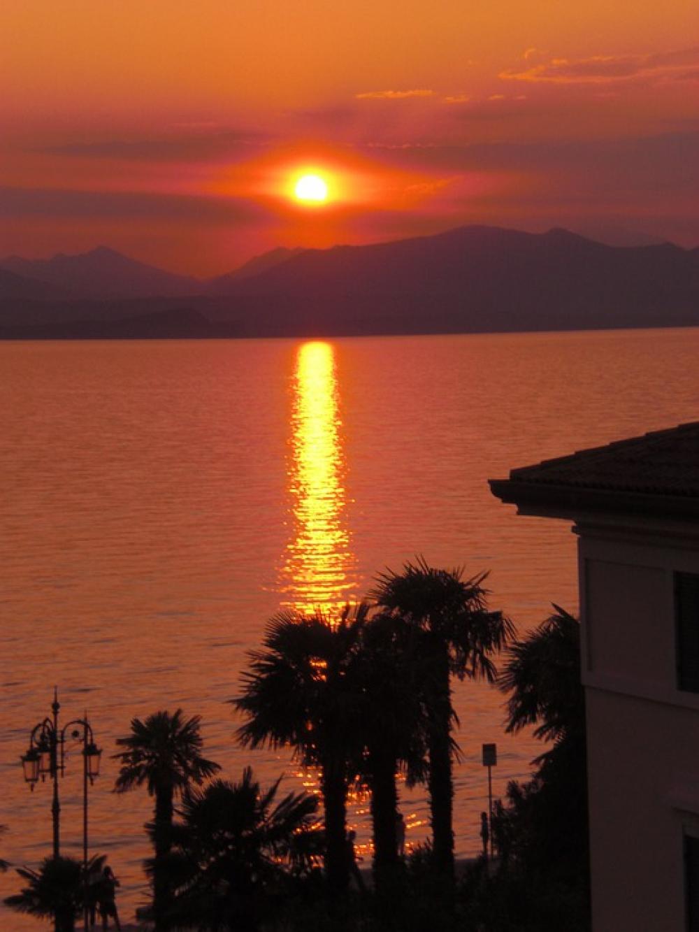 Italy Garda Travel Sunset At Dusk Ray Of Light Italy Garda Travel Sunset At Dusk Ray Of Light