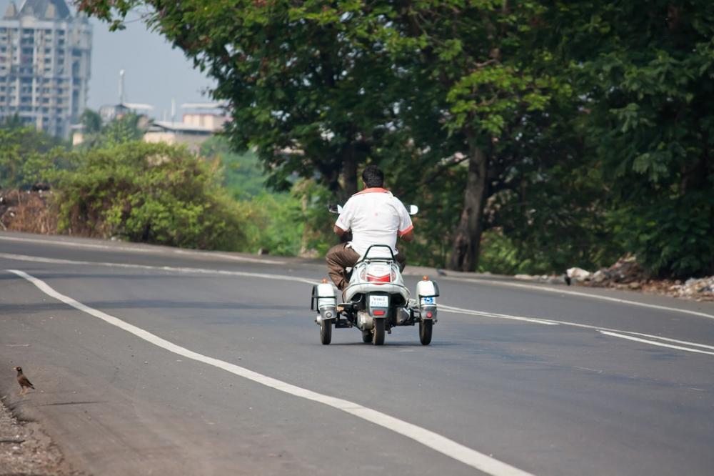 Scooter Trike India Road Traffic Vehicle Tricycle Scooter Trike India Road Traffic Vehicle Tricycle
