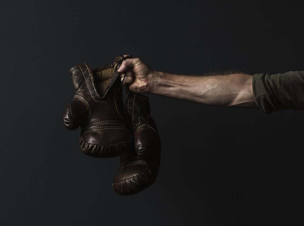 Antique Boxing Gloves In Hand Photo Antique Boxing Gloves In Hand Photo