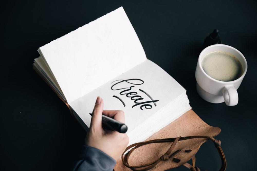 Artist Writing In Journal Photo Artist Writing In Journal Photo