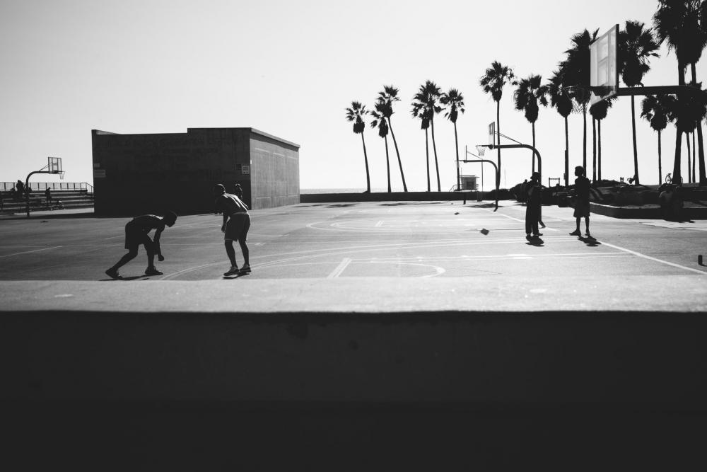 Black And White People Playing Basketball Near Beach Photo Black And White People Playing Basketball Near Beach Photo