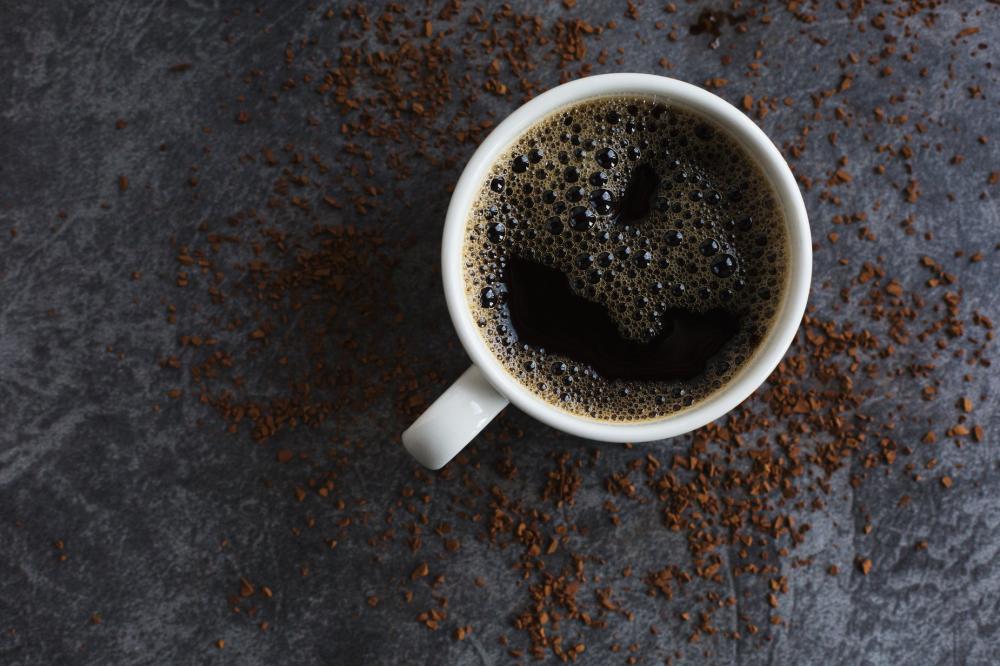 Black Coffee And Spilled Instant Granules Photo Black Coffee And Spilled Instant Granules Photo