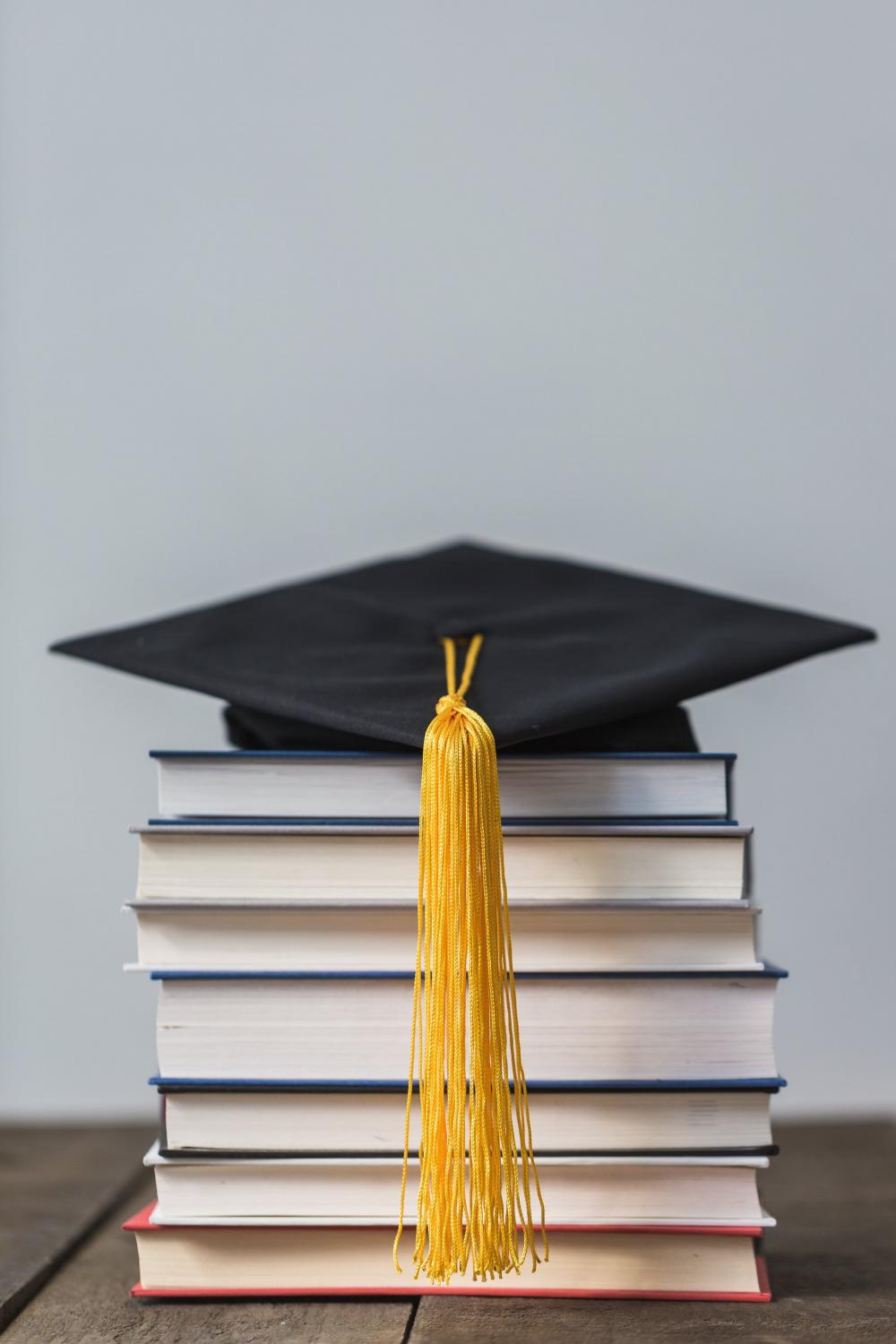 Books And Graduation Cap Photo Books And Graduation Cap Photo