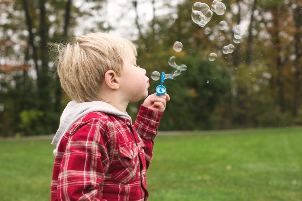 Boy Blowing Bubbles Photo Boy Blowing Bubbles Photo