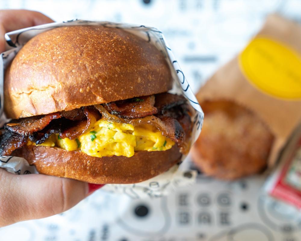 Breakfast Sandwich In Hand Photo Breakfast Sandwich In Hand Photo