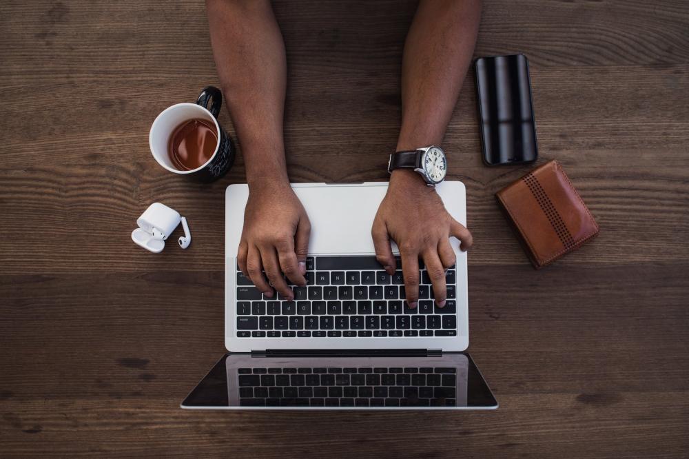Busy Hands Typing In Flatlay Photo Busy Hands Typing In Flatlay Photo