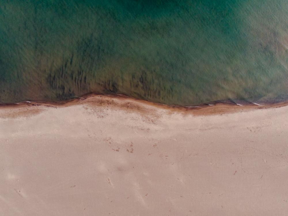 Contrast Between Sand And Sea Photo Contrast Between Sand And Sea Photo