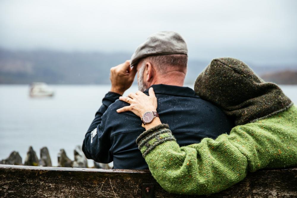 Couple Sits In British Rain Photo Couple Sits In British Rain Photo
