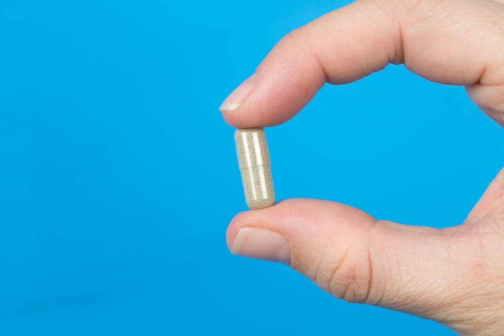 Hand With Pill Photo Hand With Pill Photo