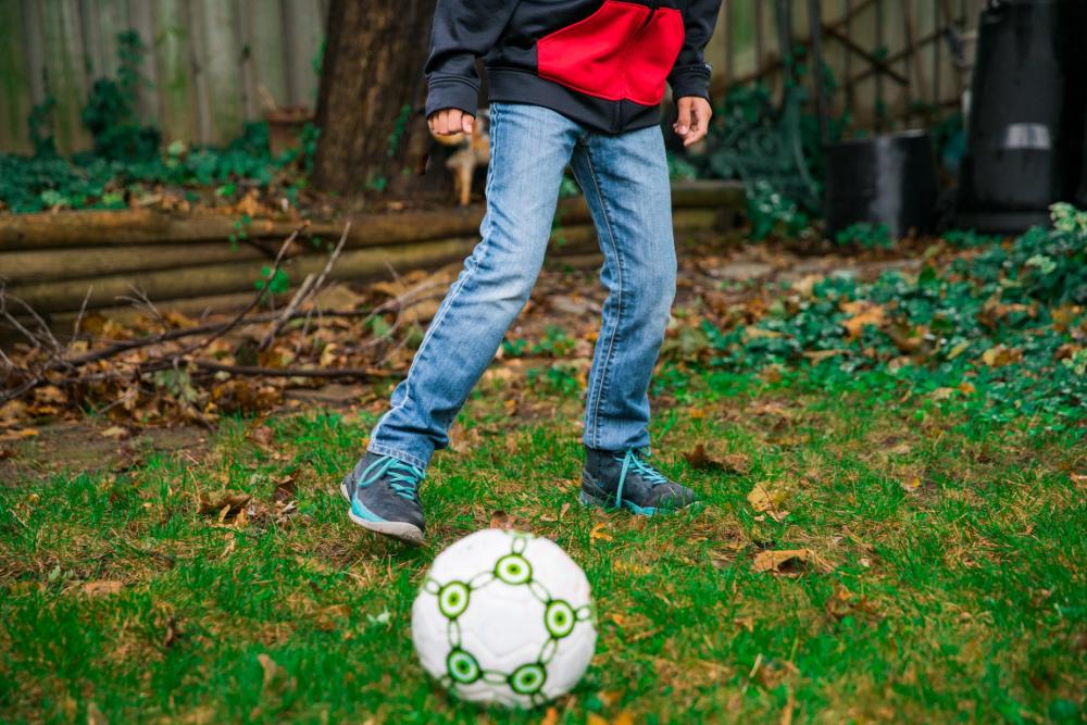 Kid Plays Soccer Photo Kid Plays Soccer Photo