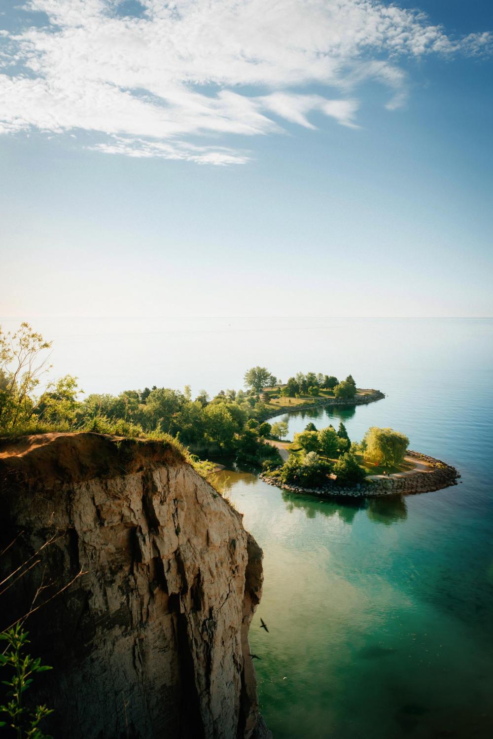 Lakeside Cliffs And Blue Sky Photo Lakeside Cliffs And Blue Sky Photo