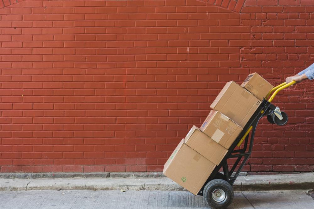 Shipping Boxes In Front Of Red Brick Photo Shipping Boxes In Front Of Red Brick Photo