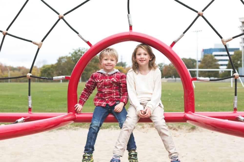 Siblings Smiling At Park Photo Siblings Smiling At Park Photo