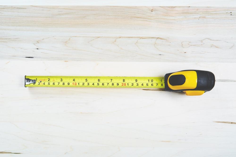 Tape Measure On Wood Photo Tape Measure On Wood Photo