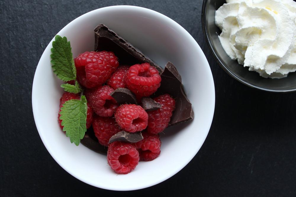 Top View Of Raspberries Chocolate And Mint In White Dish Photo Top View Of Raspberries Chocolate And Mint In White Dish Photo
