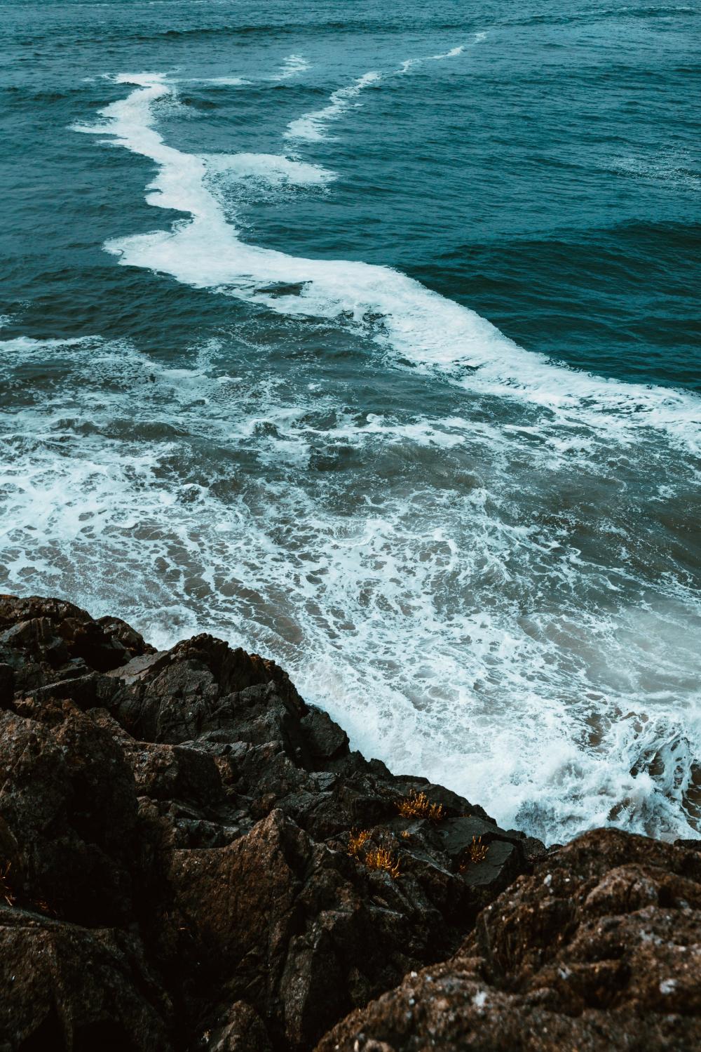 Waves Crash On Rocks Photo Waves Crash On Rocks Photo