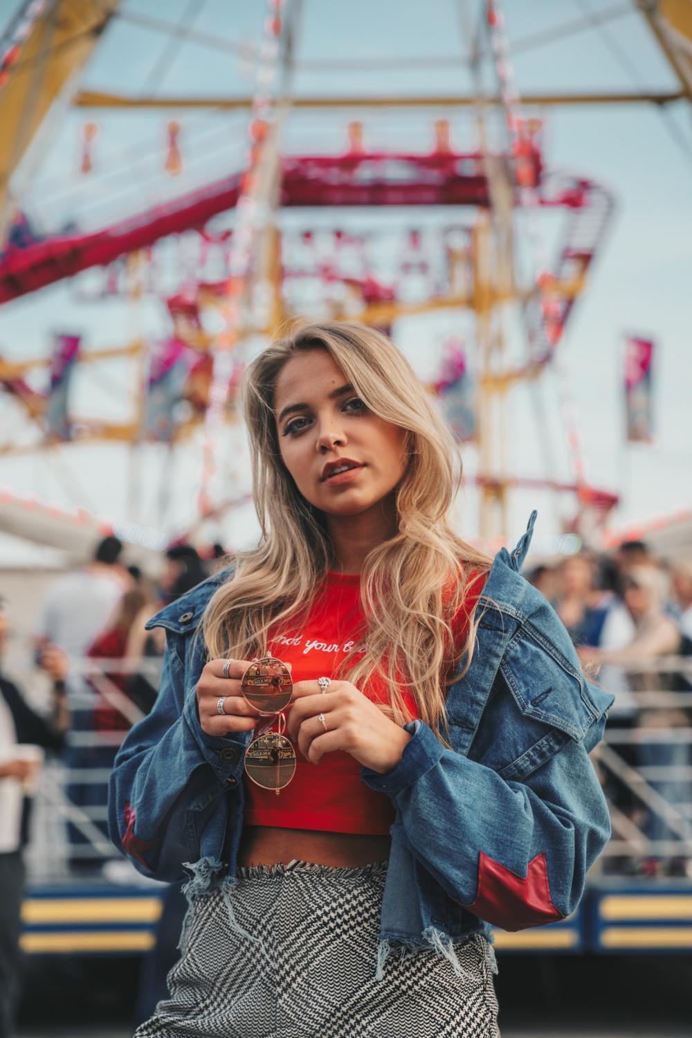 Young Woman Posing At Carnival Photo Young Woman Posing At Carnival Photo