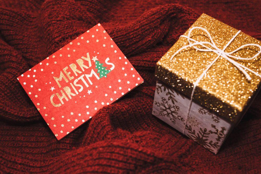 Christmas card and a gift box Christmas card and a gift box