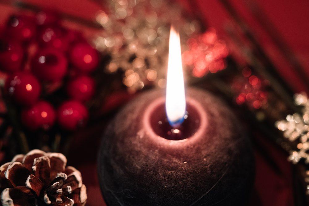 Christmas wreath and a round candle closeup 2 Christmas wreath and a round candle closeup 2