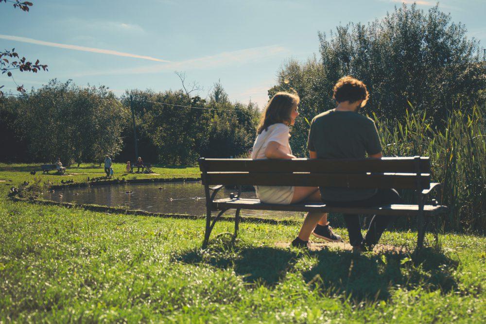 Couple sitting on a bench Couple sitting on a bench