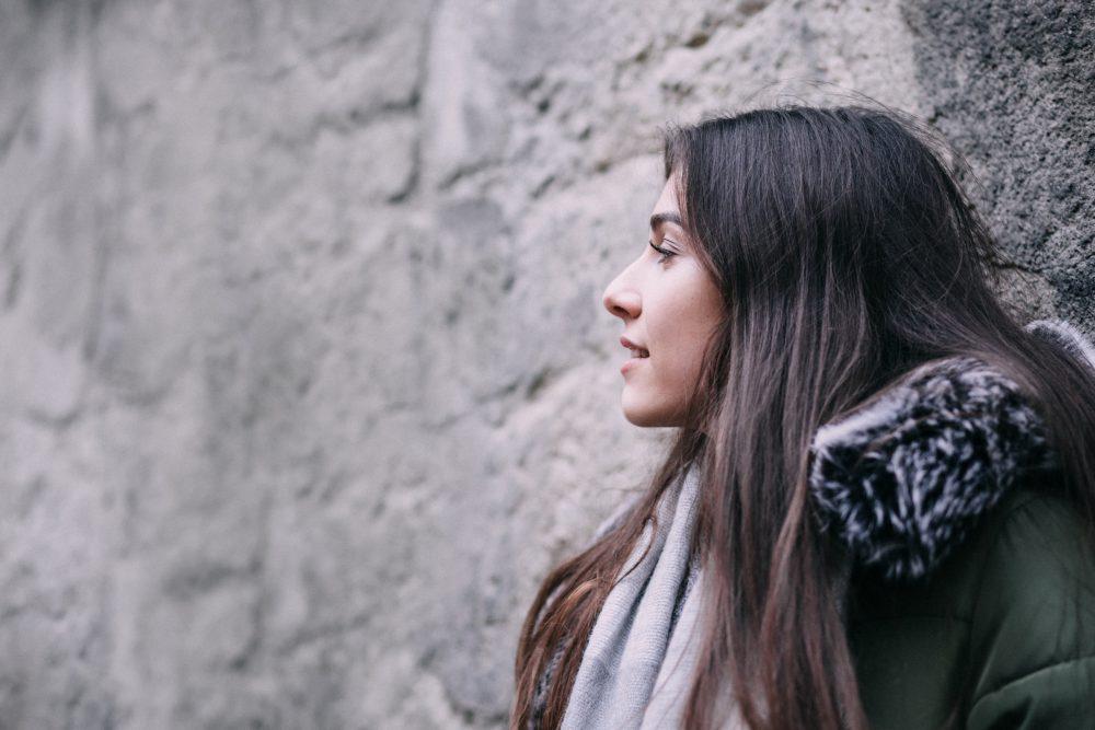 A girl leaning against a wall A girl leaning against a wall