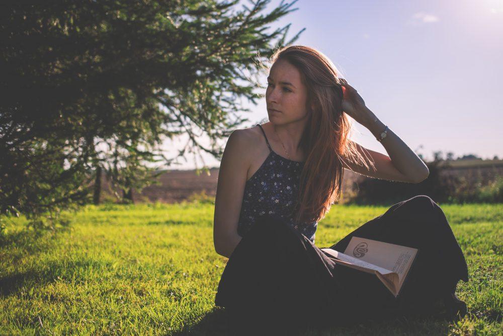 Girl sitting on the grass Girl sitting on the grass