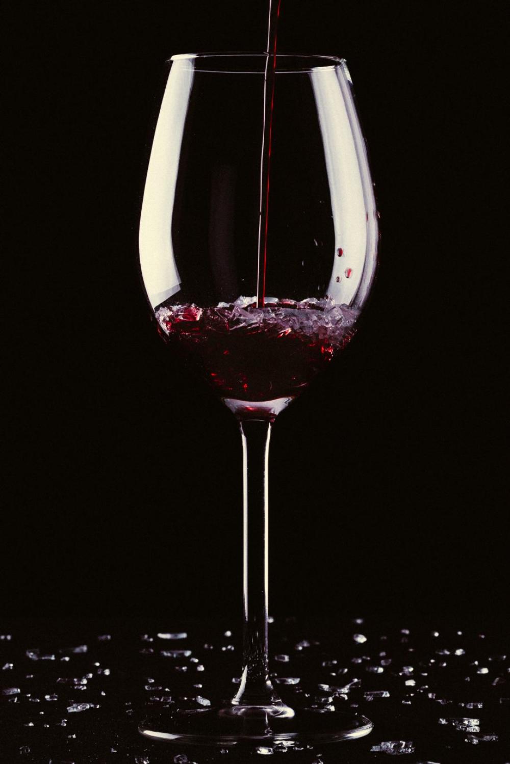 Glass of wine with broken glass Glass of wine with broken glass