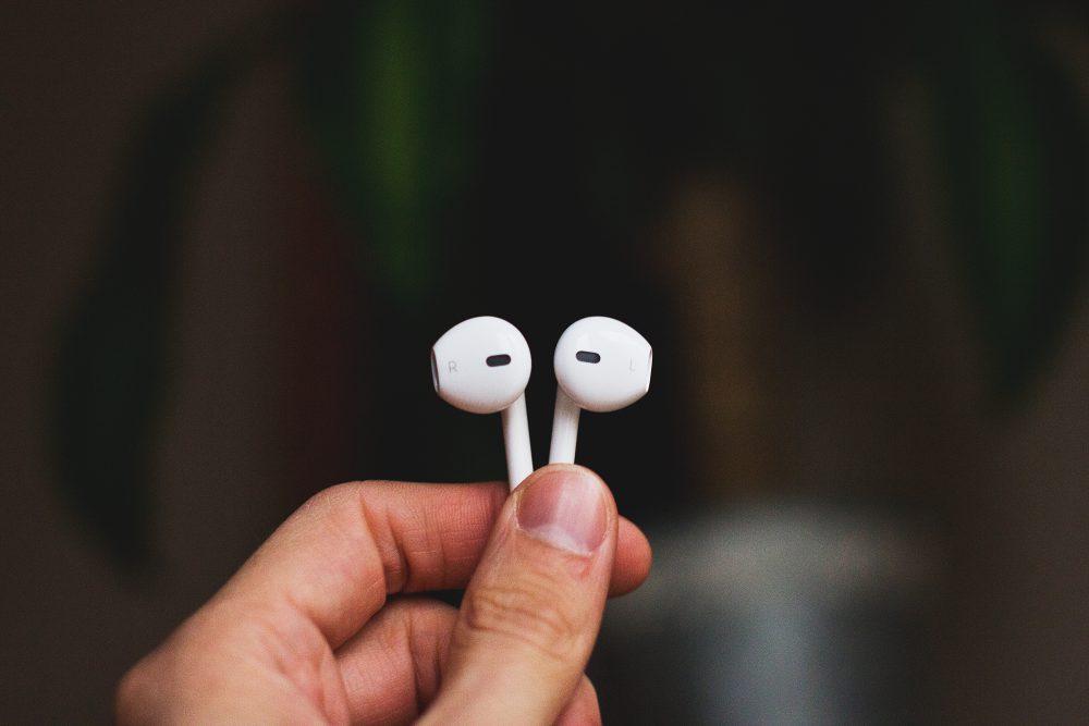 iPhone headphones in a male hand 2 iPhone headphones in a male hand 2