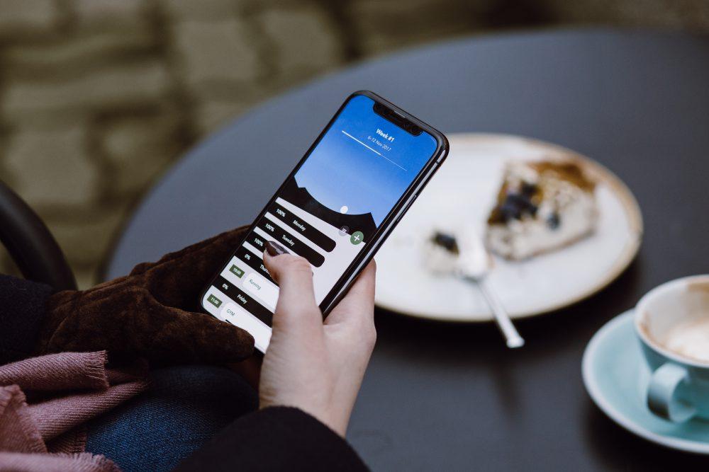 iPhone X in female hands outdoors iPhone X in female hands outdoors